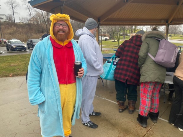 Sean Powers waits in line for registration at Fairport Harbor Arts and Culture Alliance Port Plunge. (Frank Mecham- The News-Herald.)